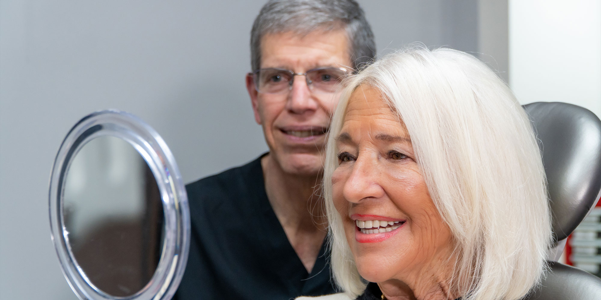 patient smiling brightly after their dental procedure within the dental center