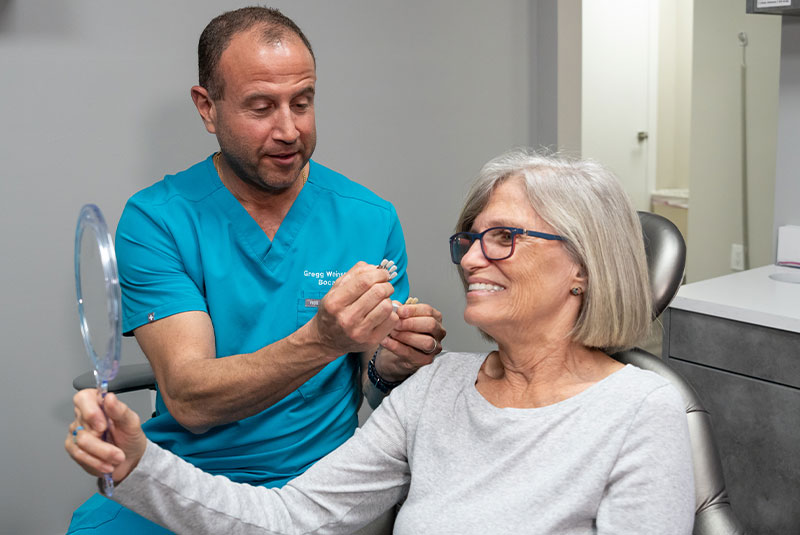 patient smiling brightly with the doctor for their dental treatment