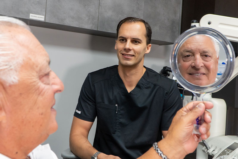 patient smiling brightly after their dental treatment within the dental center