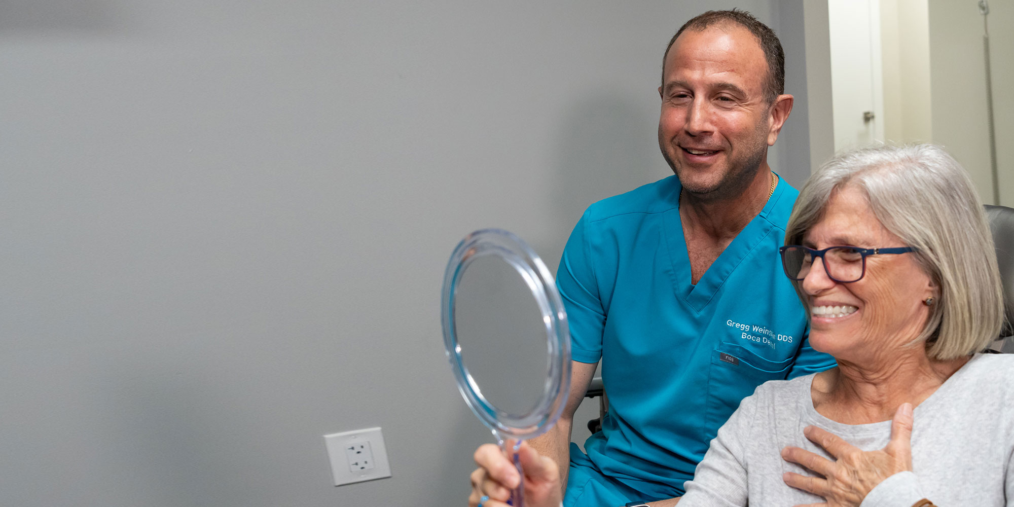 patient smiling brightly and emotionally after having their dental treatment