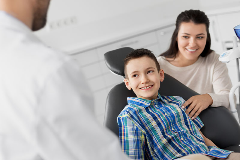 child patient at the dental center ready for treatment